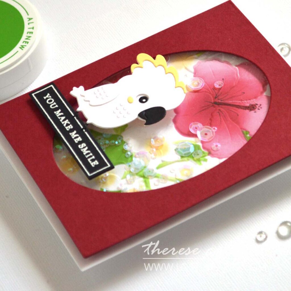 A2 shaker card with embossed ink-blended floral background and a die-cut bird sitting on the sentiment.