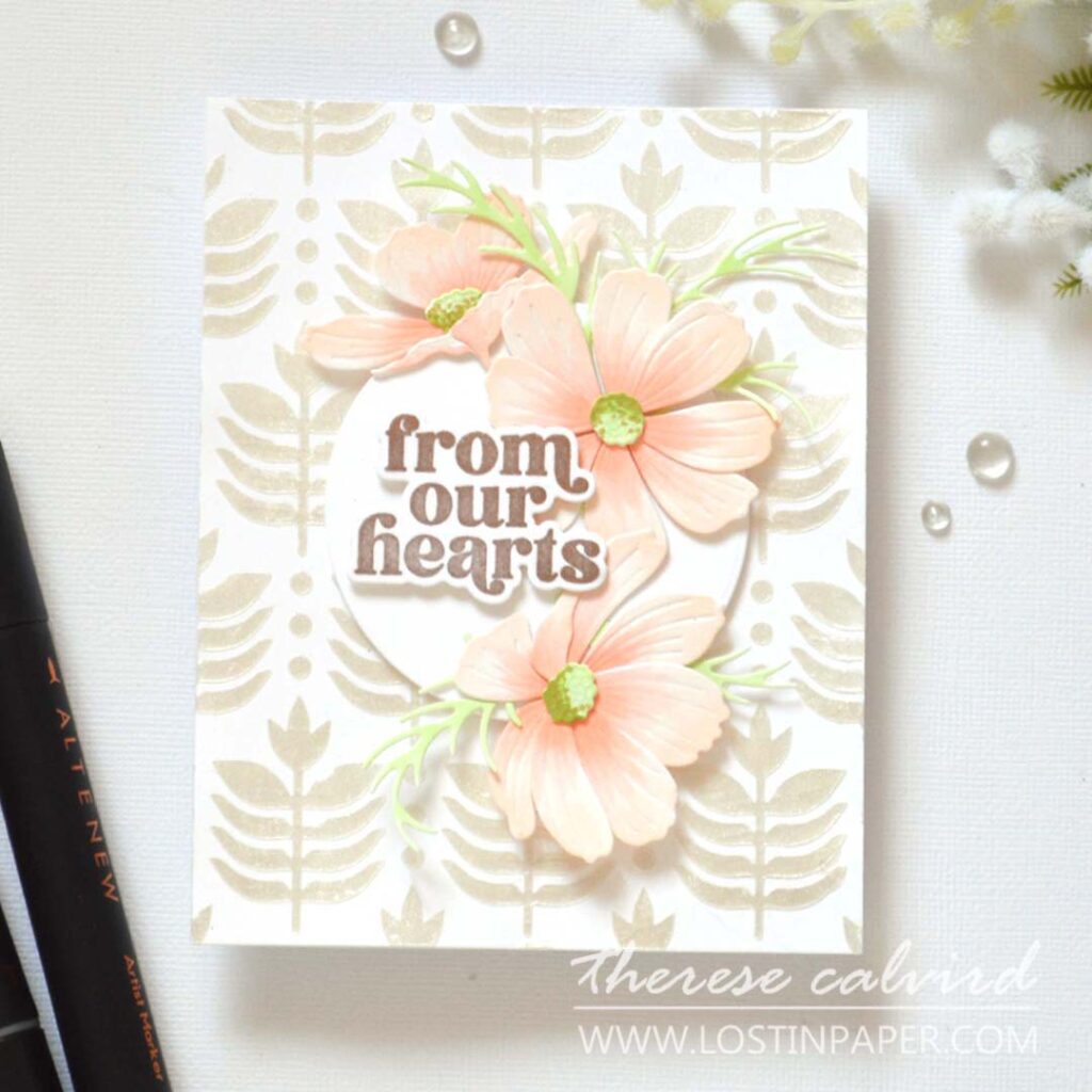 Handmade card with layered Cosmos flowers as a central focal point on a textured background with sentiment