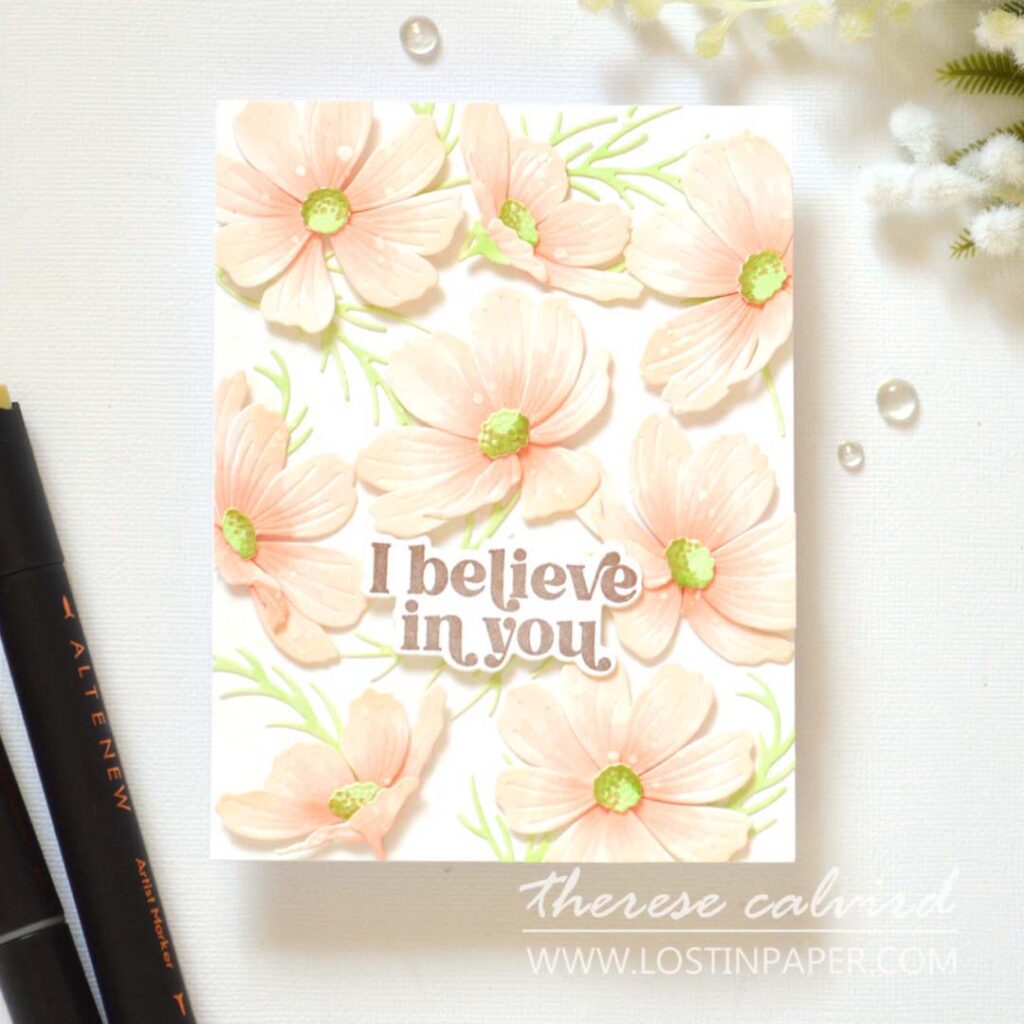Handmade card with a sea of layered Cosmos flowers covering the entire background