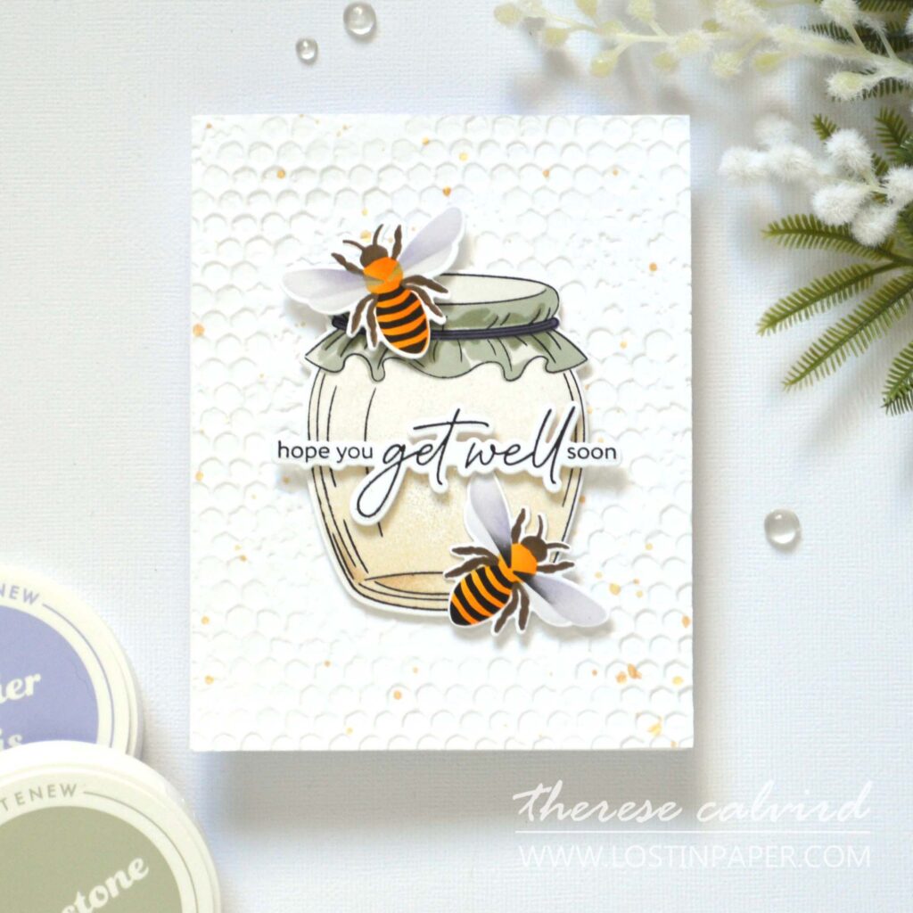 Handmade focal point card featuring a jar of honey, two bees, and a 3D embossed background with sentiment across the center
