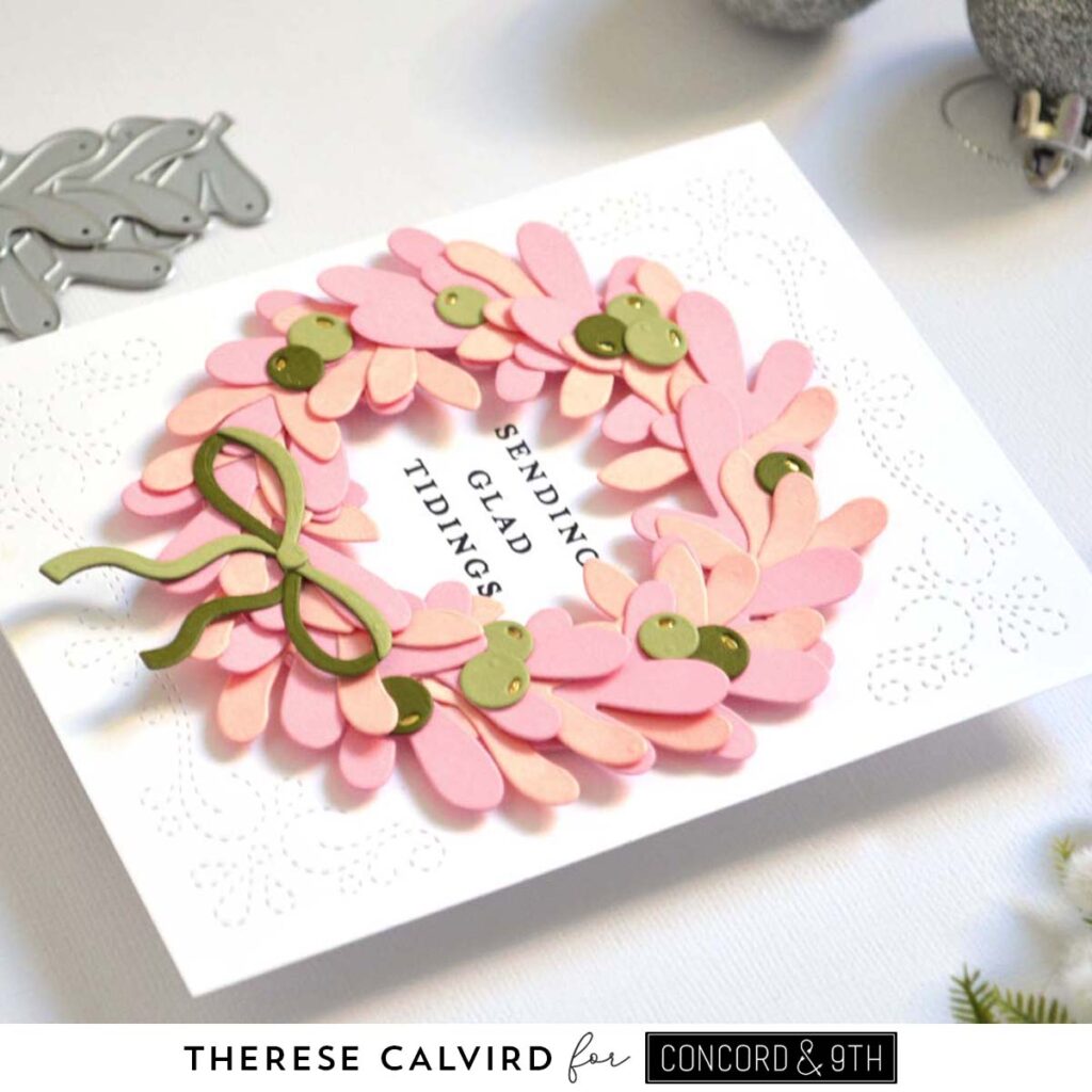 Holiday card featuring a die cut wreath in nectar and pink tones with a coordinating sentiment
