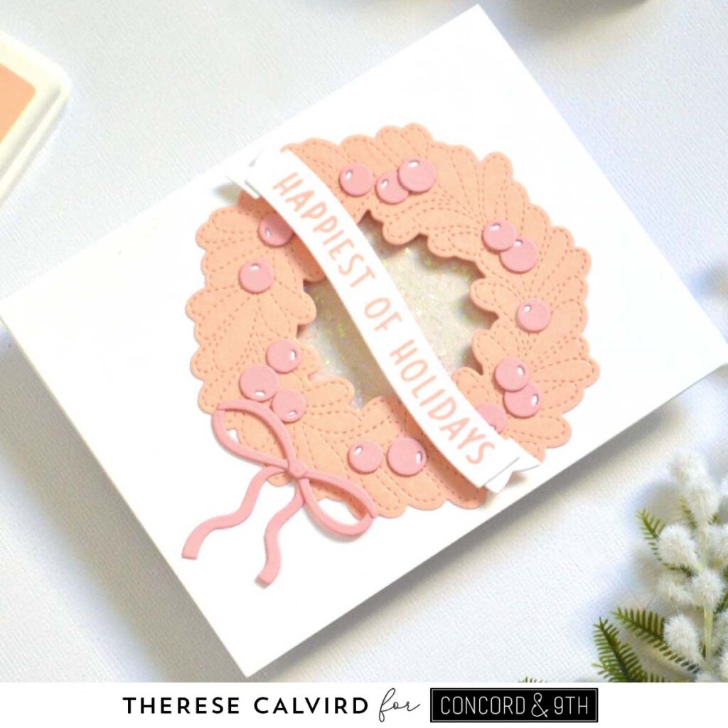 Holiday card featuring a die cut wreath in nectar and pink tones with a coordinating sentiment
