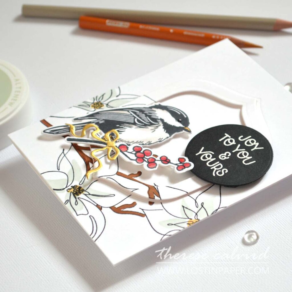 Eclipse technique bird Christmas card with hidden die-cut frame and festive floral branch – designed by Therese Calvird.