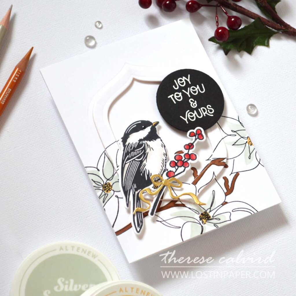 Eclipse technique bird Christmas card with hidden die-cut frame and festive floral branch – designed by Therese Calvird.