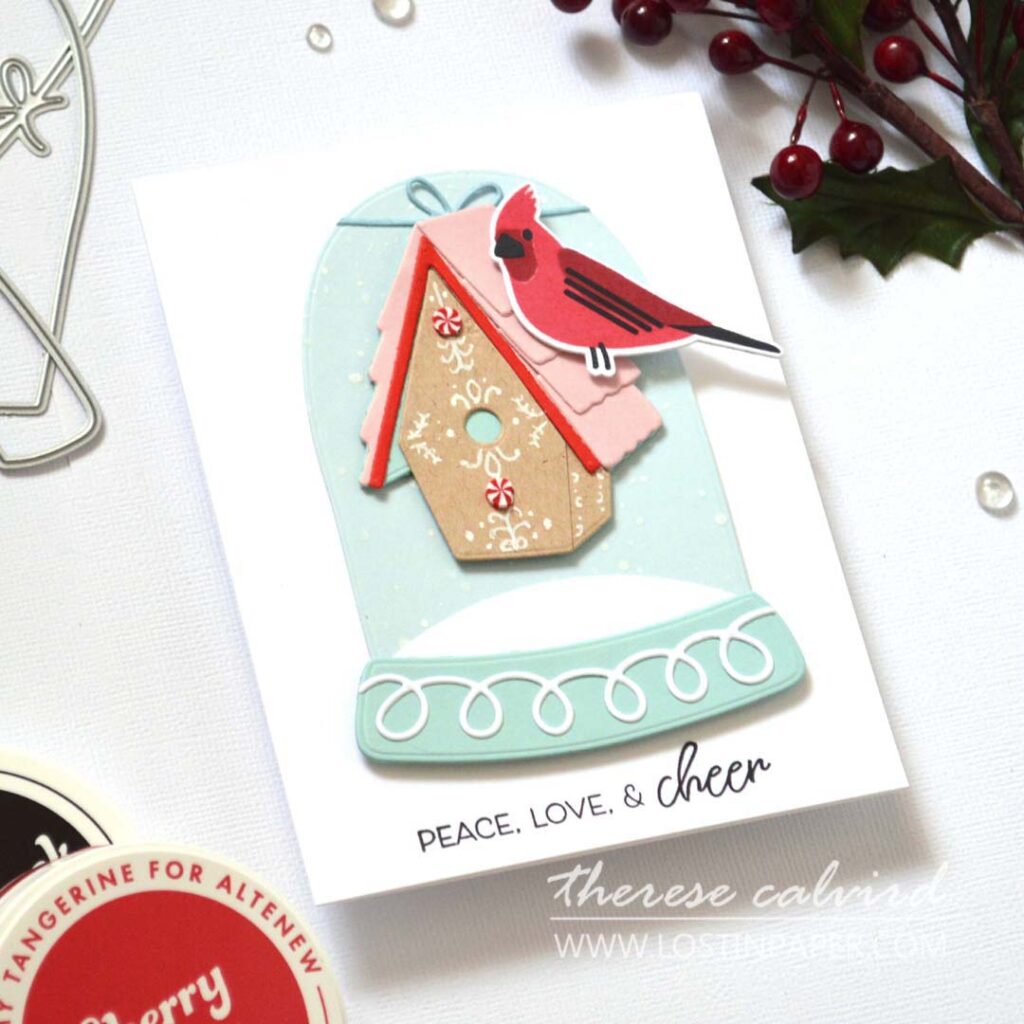 Clean and simple layered stamped bird card featuring a gingerbread-style birdhouse hung from a snow globe with a cardinal perched on the roof by Therese Calvird