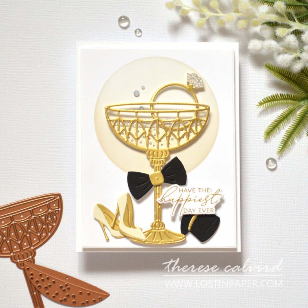 Elegant gold wedding card featuring a metallic die-cut champagne glass with rhinestones by Therese Calvird.