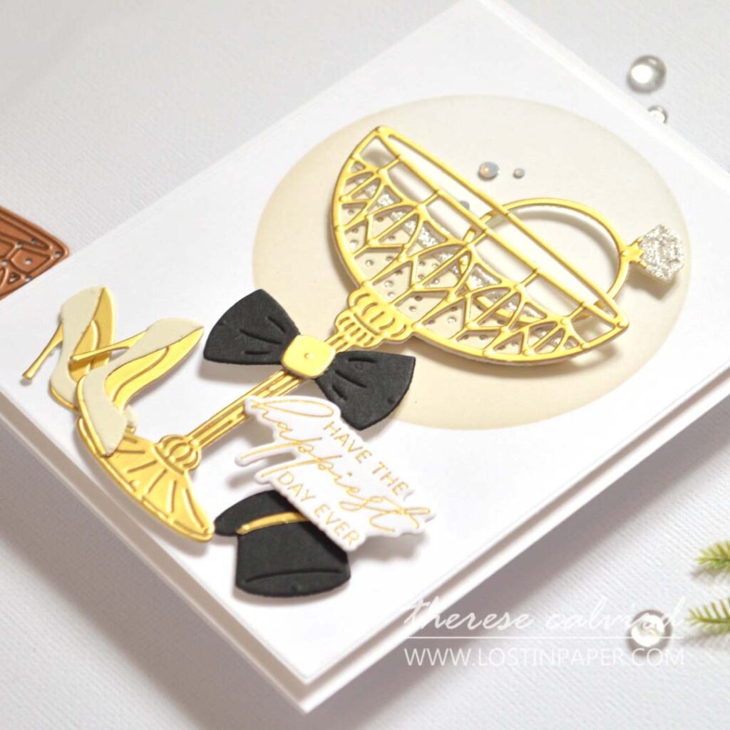 Elegant gold wedding card featuring a metallic die-cut champagne glass with rhinestones by Therese Calvird.