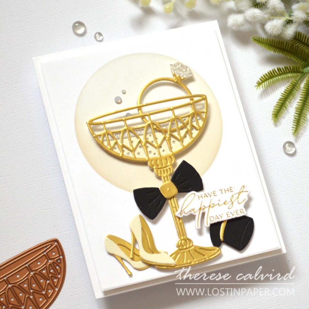 Elegant gold wedding card featuring a metallic die-cut champagne glass with rhinestones by Therese Calvird.