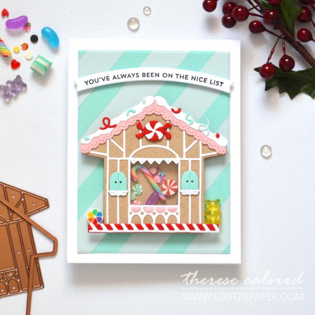 Gingerbread house shaker card filled with sweets and a striped background by Therese Calvird