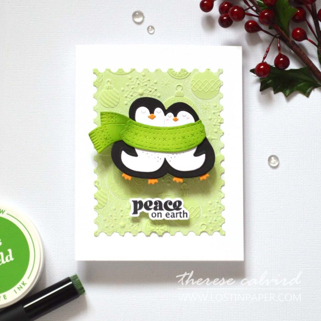 Layered die-cut penguins on a 3D embossed background with soft white ink; simple pop-ups add dimension.