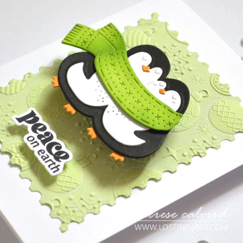 Layered die-cut penguins on a 3D embossed background with soft white ink; simple pop-ups add dimension.