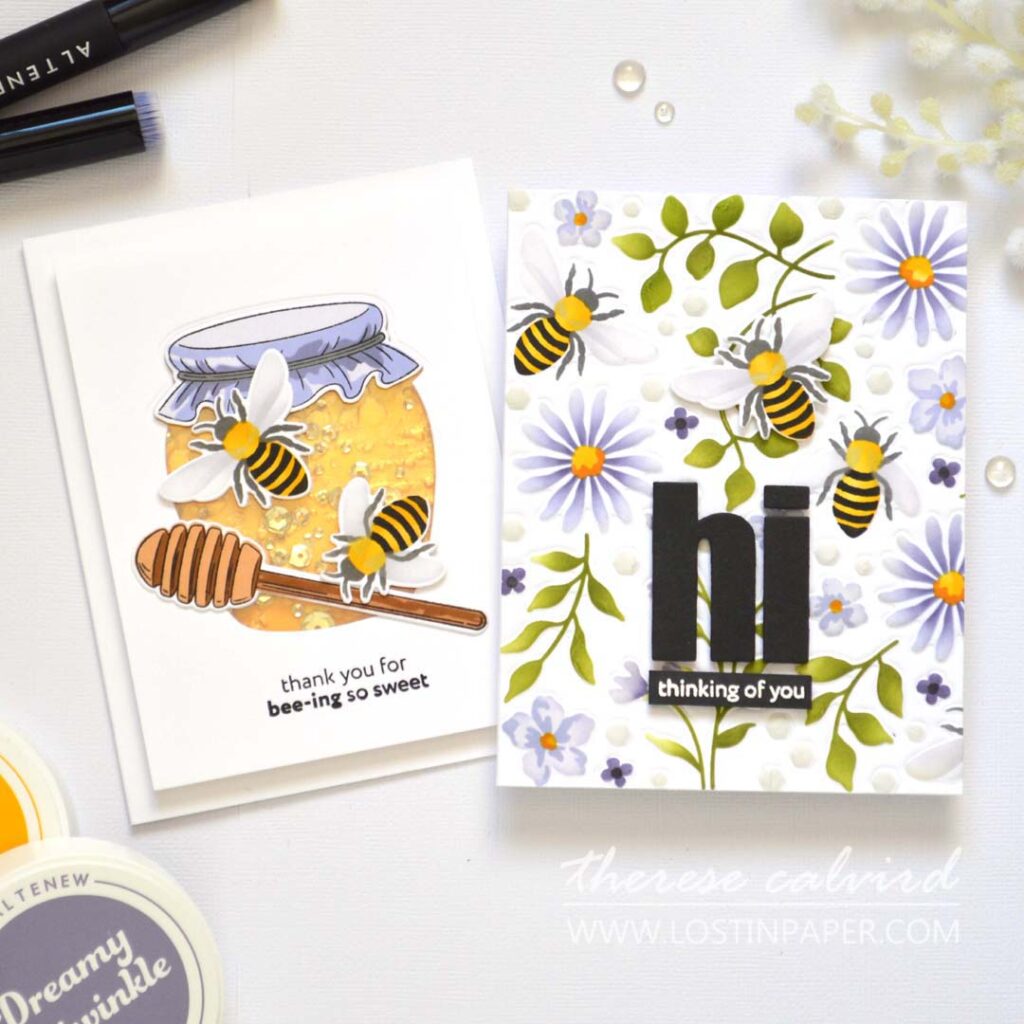 Two handmade bee-themed cards side by side — one with an ink-blended floral background and embossed die detail, the other a honey jar shaker with gold accents and sequins.