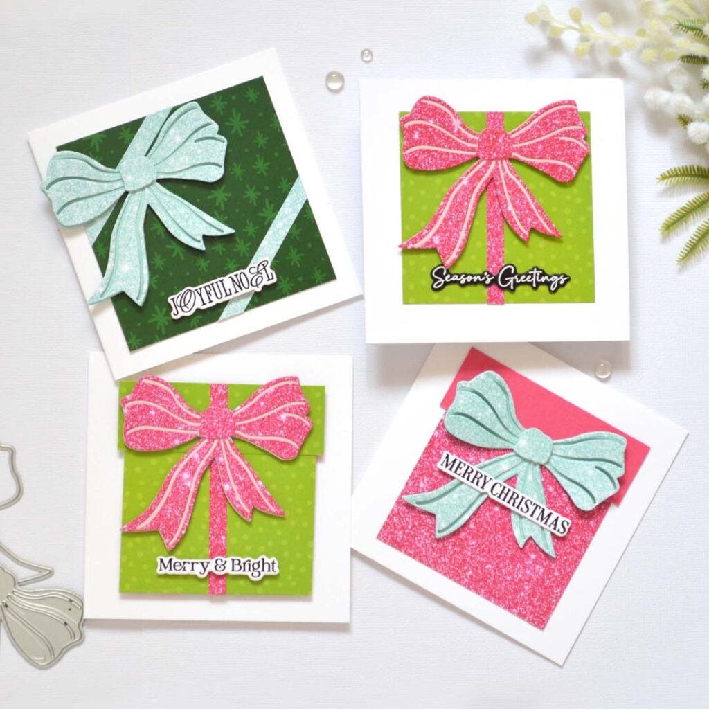 Group of handmade Christmas cards from Therese Calvird’s Same But Different Christmas series featuring die-cut gift box designs with patterned paper and faux glitter bows.