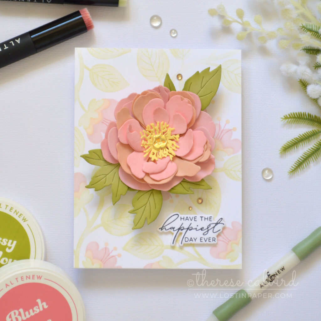 Pink layered flower card featuring a dimensional die cut bloom over a pastel ink blended stencil background