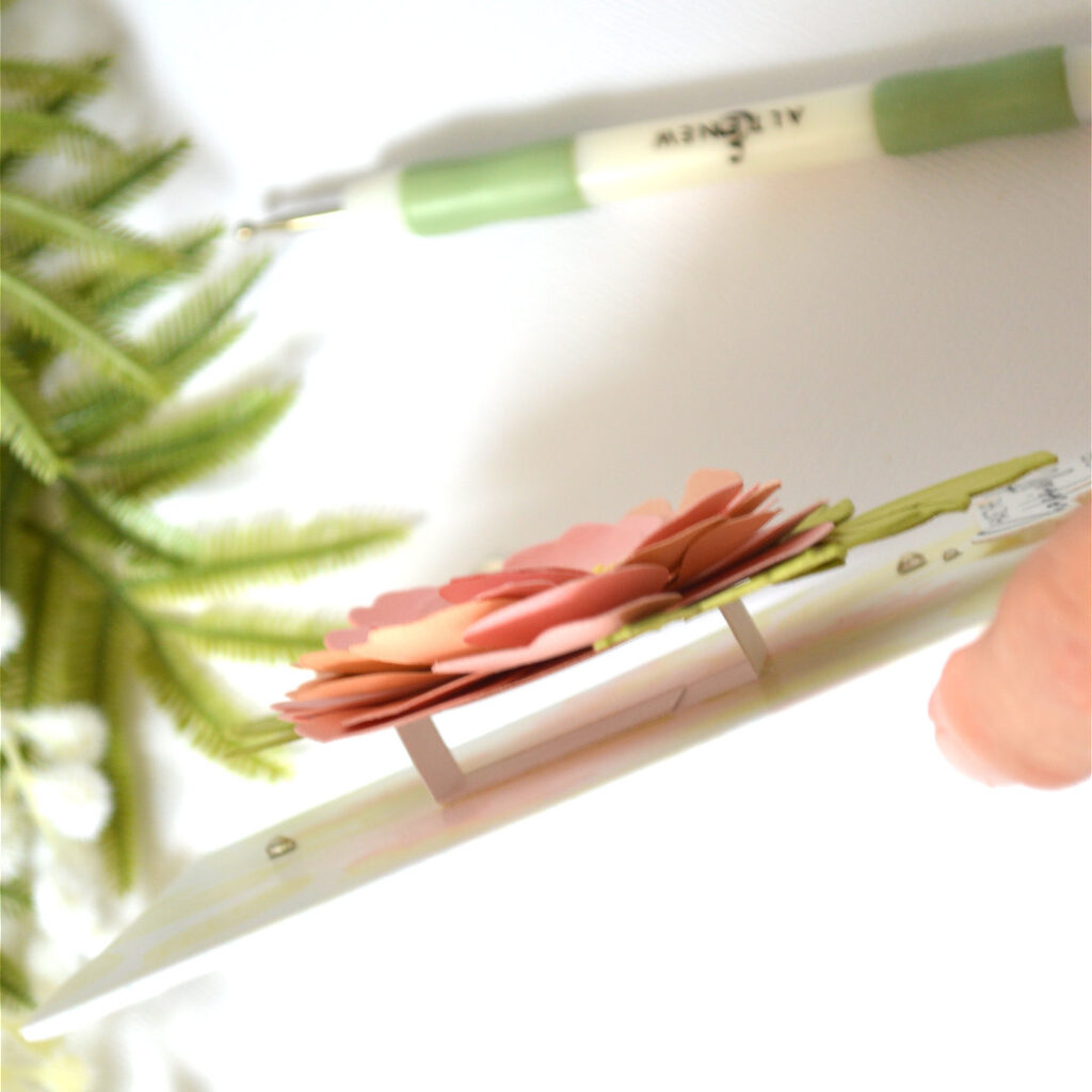 Pink layered flower card featuring a dimensional die cut bloom over a pastel ink blended stencil background