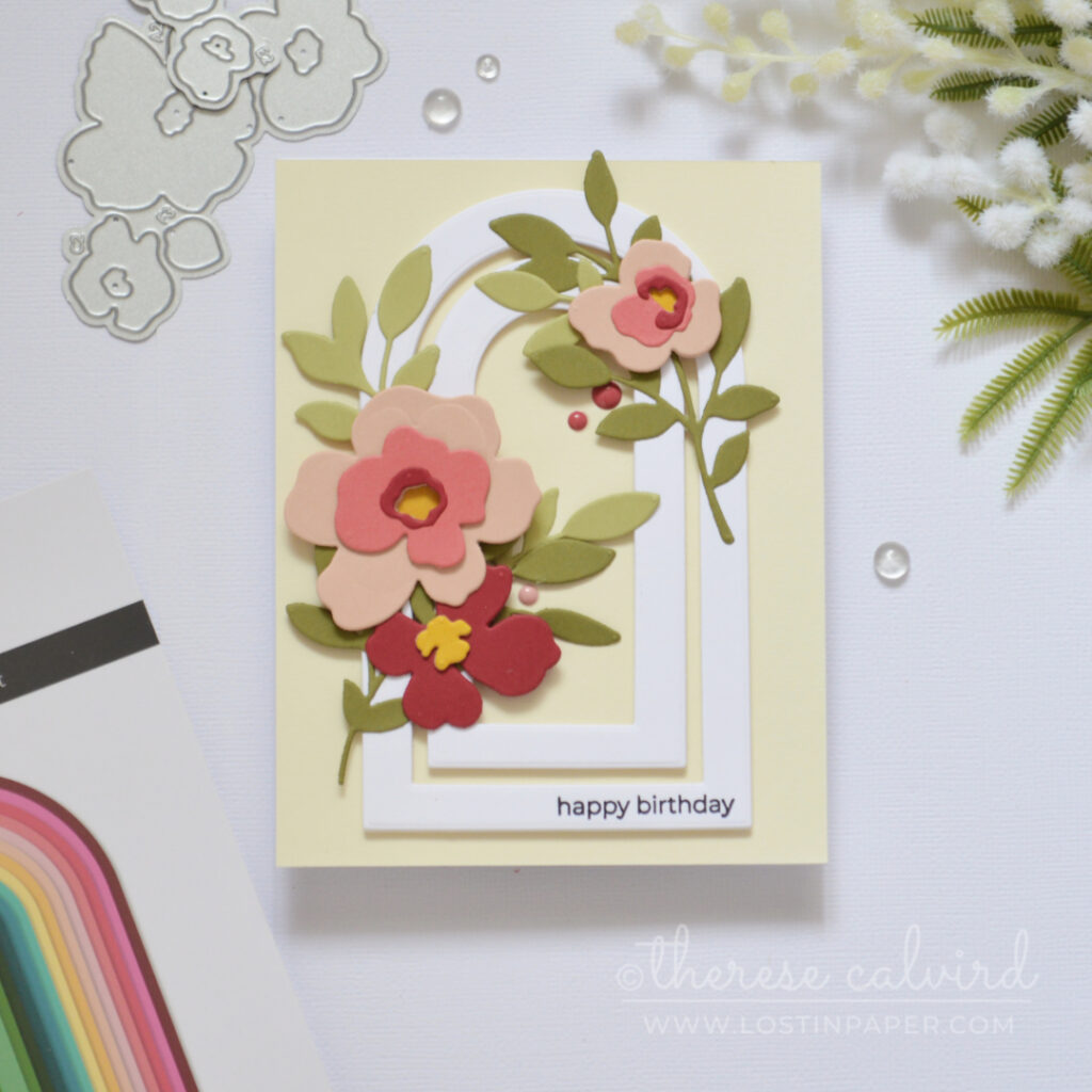 Handmade card with layered nesting arch frames and modern floral die cuts with sentiment on the frame by Therese Calvird