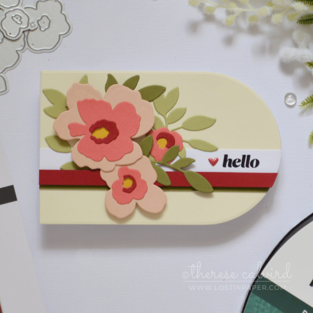 Landscape shaped handmade card using a nesting arch die with modern stripes and floral bouquet by Therese Calvird