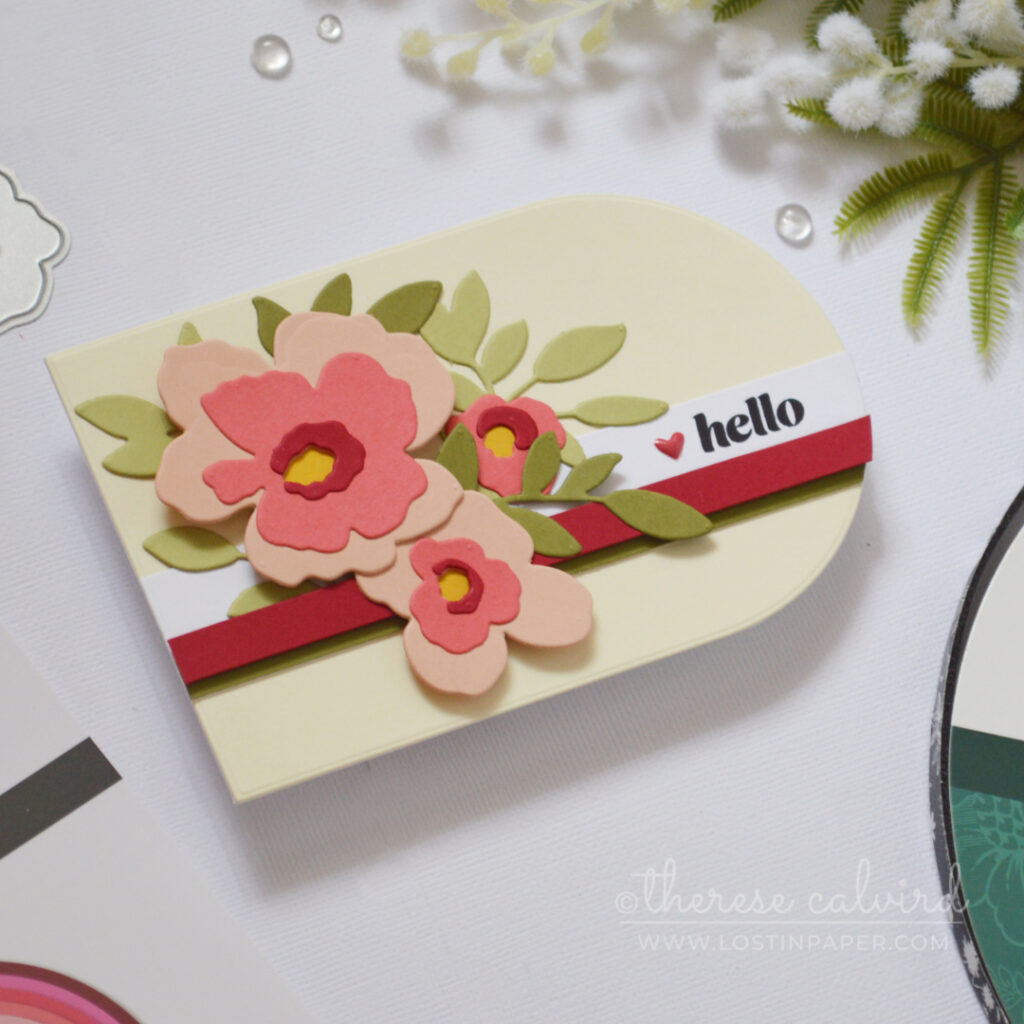 Landscape shaped handmade card using a nesting arch die with modern stripes and floral bouquet by Therese Calvird