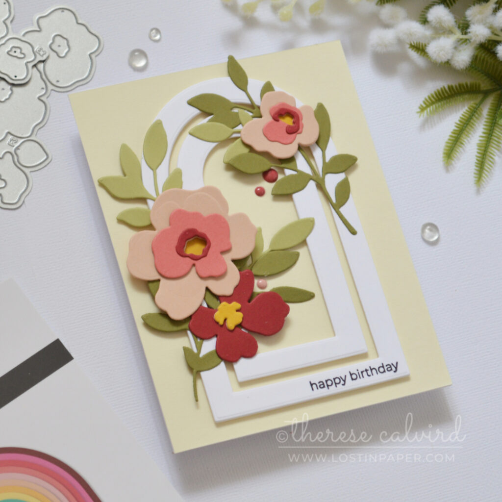 Handmade card with layered nesting arch frames and modern floral die cuts with sentiment on the frame by Therese Calvird