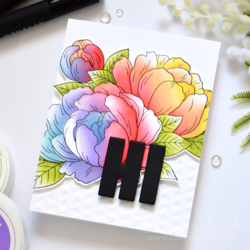 Rainbow ink blended floral bouquet card with a fussy cut floral focal point and angled embossed background by Therese Calvird
