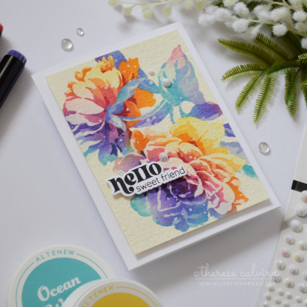 Rainbow floral card with layered stencil blooms on colored cardstock and a softly embossed background by Therese Calvird