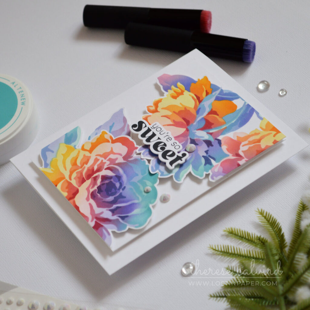 Rainbow ink blended floral card with layered stencil blooms fussy cut and popped up on a clean card design by Therese Calvird