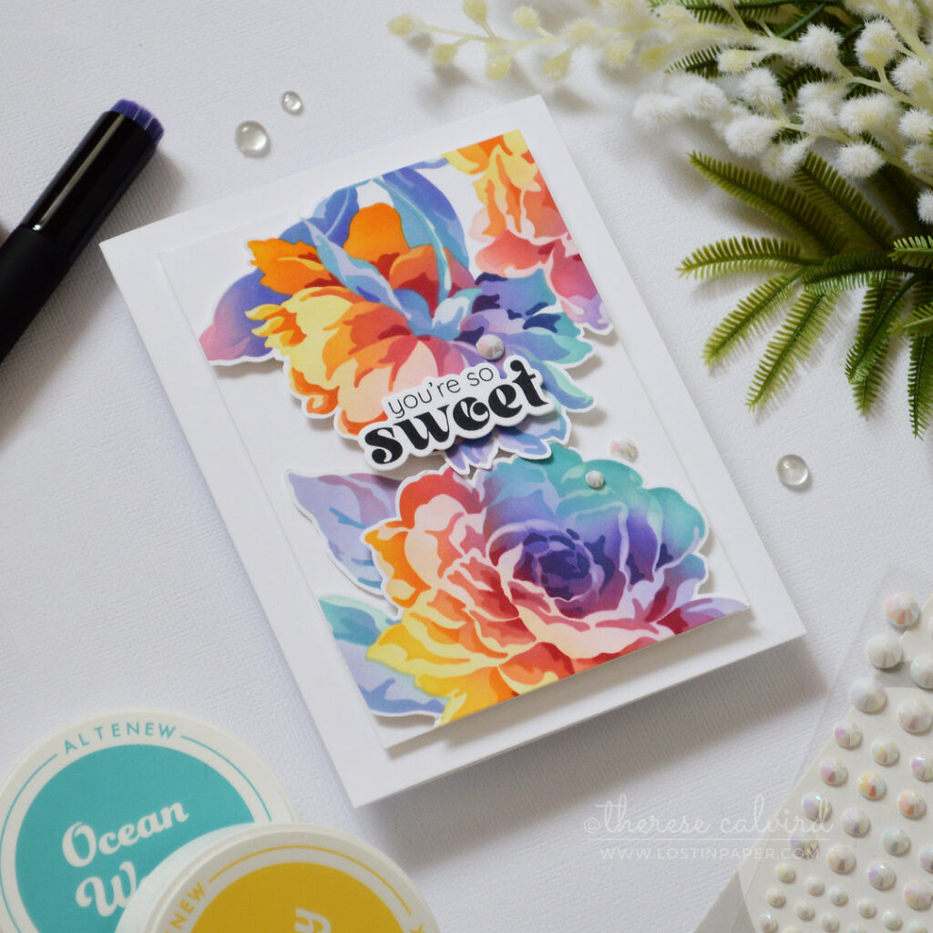 Rainbow ink blended floral card with layered stencil blooms fussy cut and popped up on a clean card design by Therese Calvird