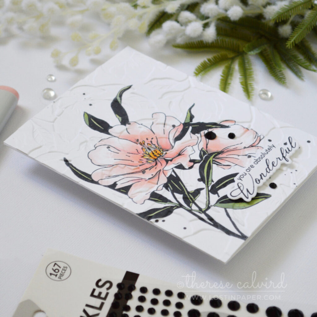 Handmade card featuring a stamped floral image with embossed texture added over the top using an embossing folder by Therese Calvird