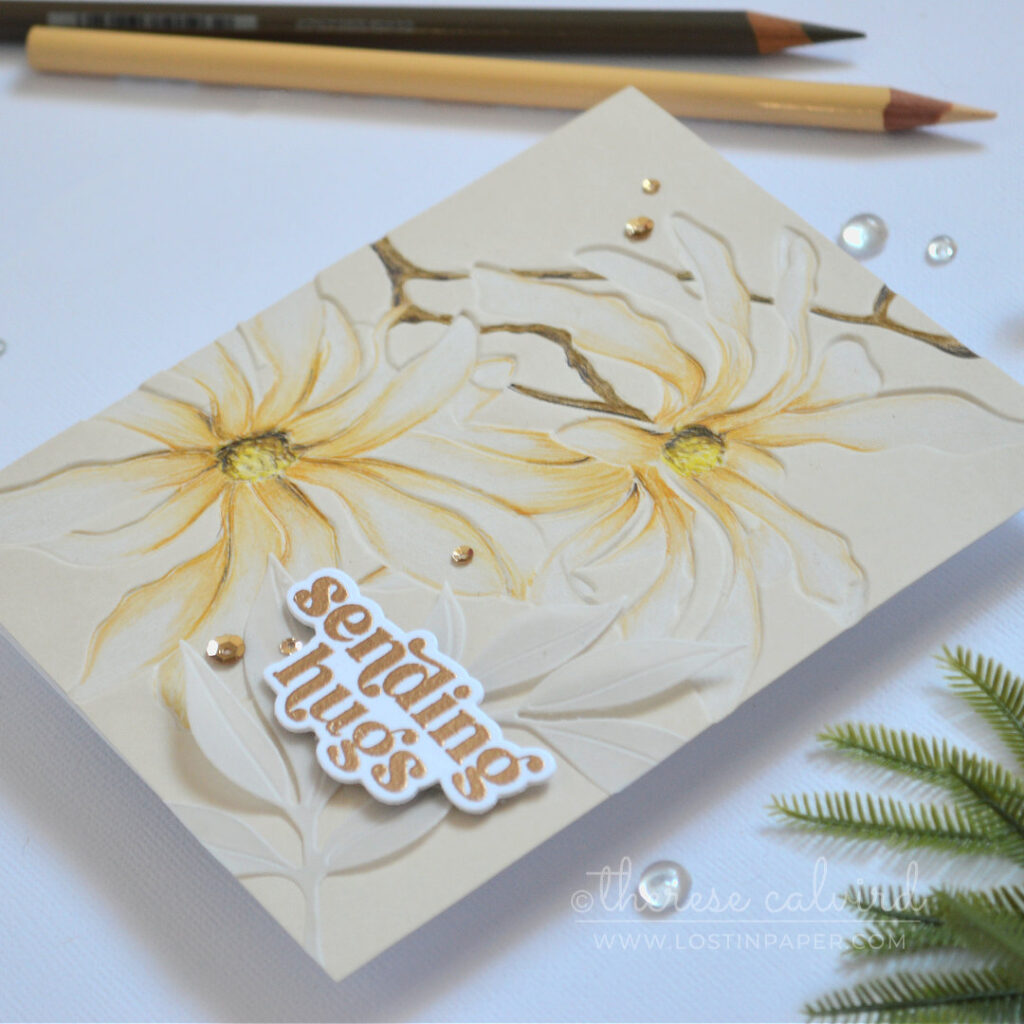 Magnolia Ballerina embossed floral card on sand colored cardstock using Prismacolor pencils on the debossed side with gold embossed sentiment and vellum leaves by Therese Calvird