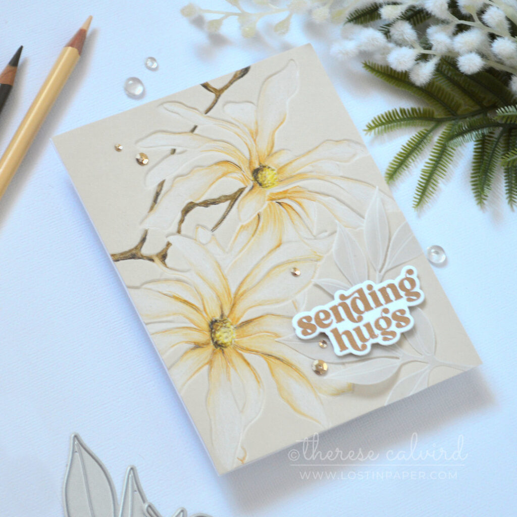 Magnolia Ballerina embossed floral card on sand colored cardstock using Prismacolor pencils on the debossed side with gold embossed sentiment and vellum leaves by Therese Calvird