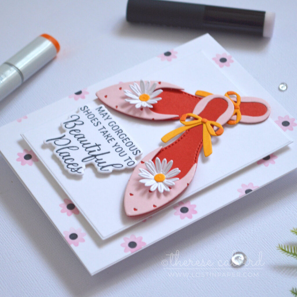 Layered die cut shoes from colored cardstock with heart detail and red inner sole by Therese Calvird.