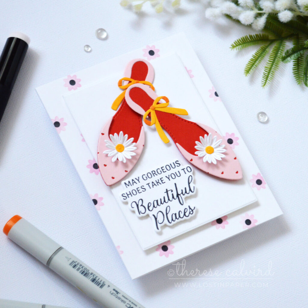 Layered die cut shoes from colored cardstock with heart detail and red inner sole by Therese Calvird.