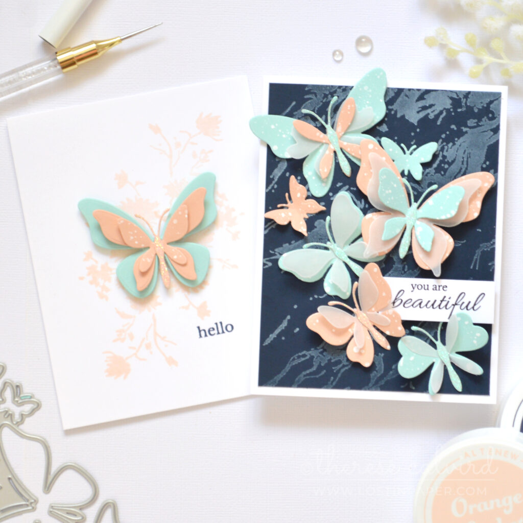 Two butterfly die cut cards with layered and clean designs in pastel and navy by Therese Calvird