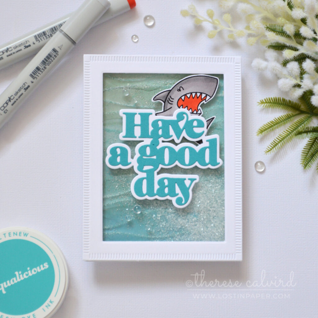 Ocean inspired shaker card with embossed design paper and shark by Therese Calvird