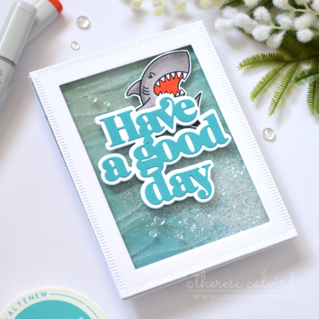 Ocean inspired shaker card with embossed design paper and shark by Therese Calvird