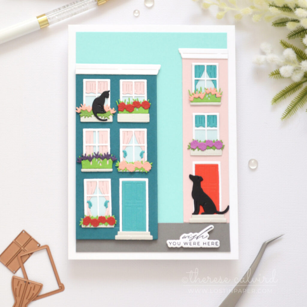 5x7 handmade card featuring dissected Everyday City Holiday die cut houses in dark teal and pale pink with shaped windows, flower boxes, cat and dog details by Therese Calvird