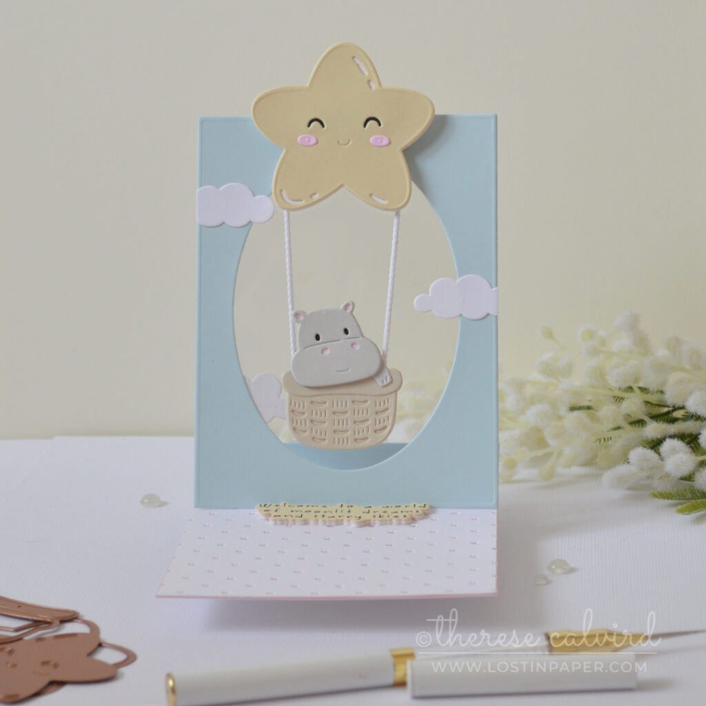 Interactive baby boy window easel card with swinging baby basket by Therese Calvird