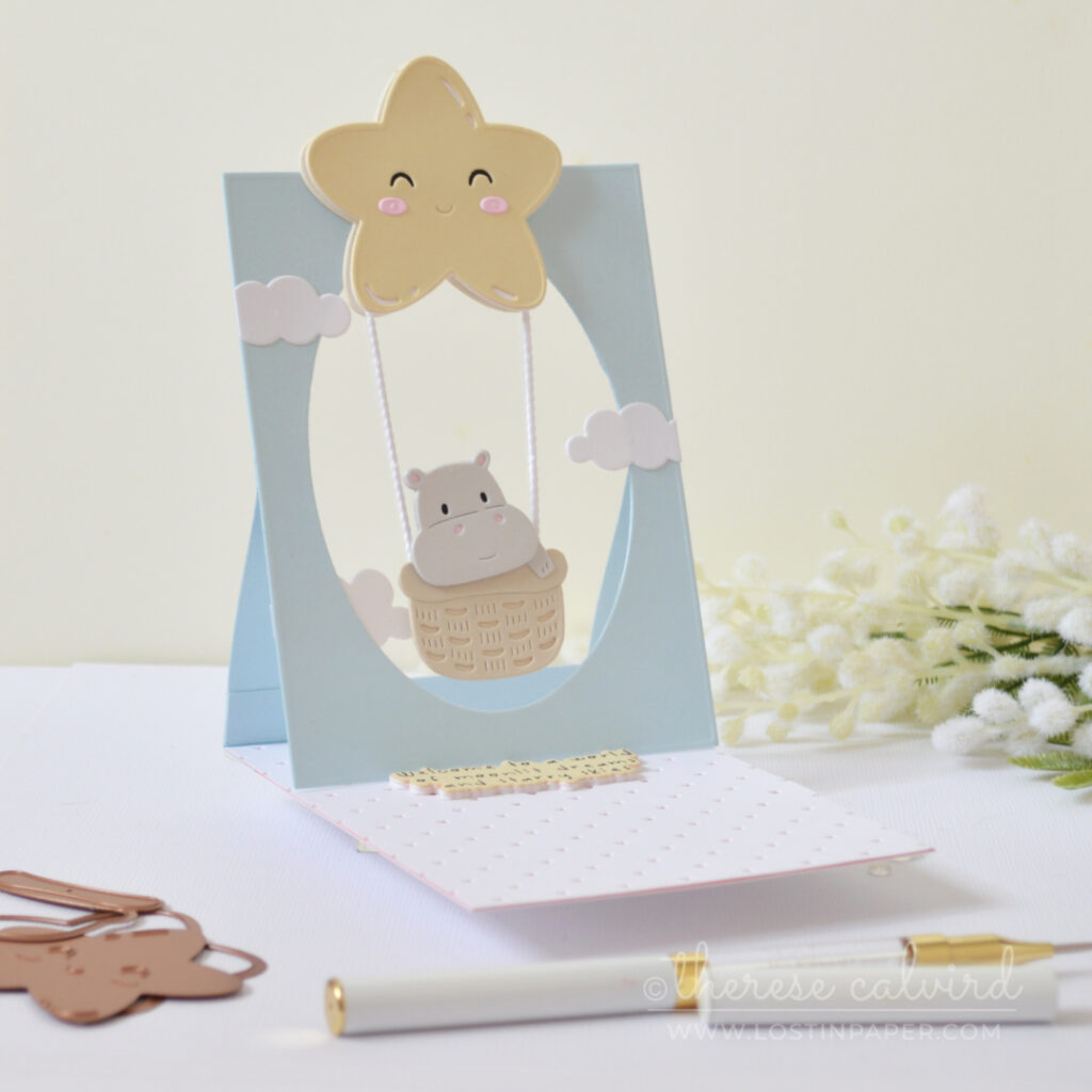 Interactive baby boy window easel card with swinging baby basket by Therese Calvird