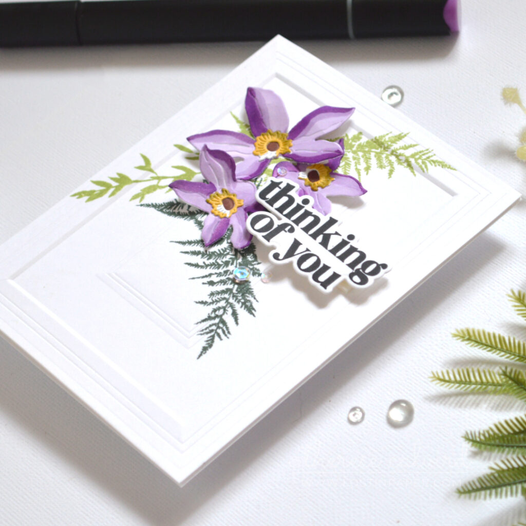 Alcohol marker floral card created with a Clematis die set by Therese Calvird