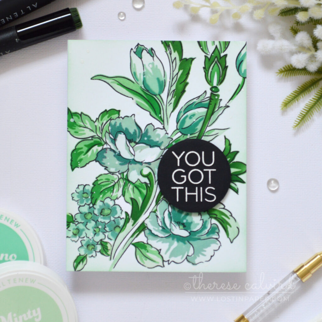 Floral card in cool mint, teal and blue-green tones with a white embossed sentiment on a black circle.