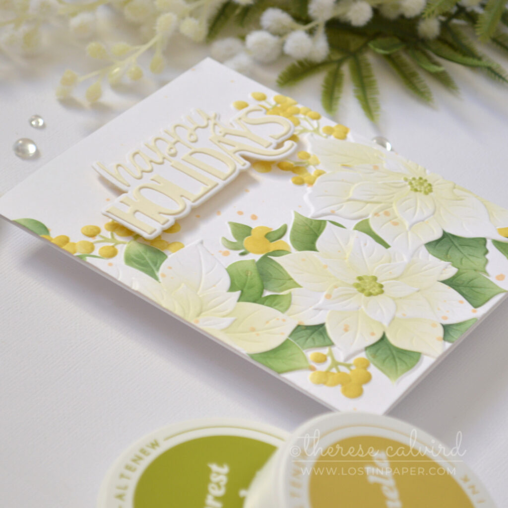 Handmade card featuring 3D embossed poinsettias with stencil ink blending, soft pistachio green centers, golden highlights, and a layered die-cut sentiment.