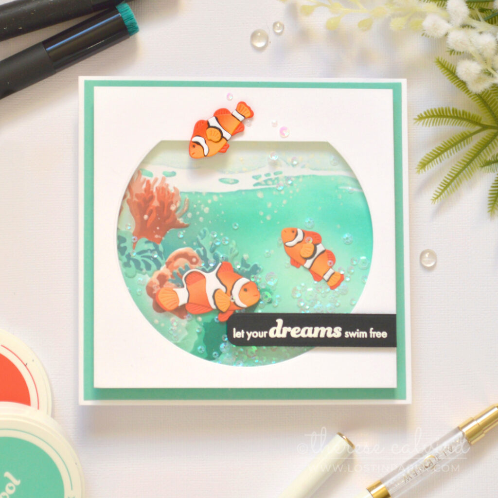 Fishbowl shaker card by Therese Calvird with anemone fish and underwater coral scene