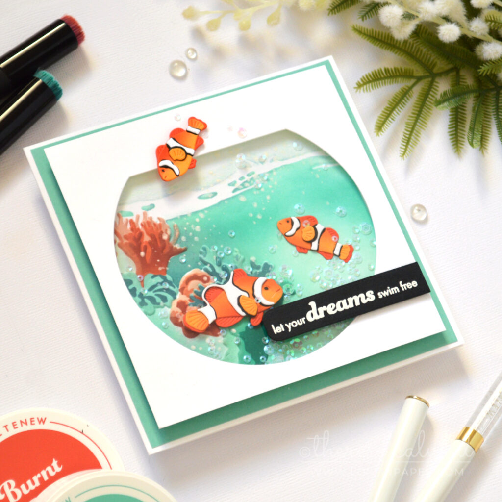 Fishbowl shaker card by Therese Calvird with anemone fish and underwater coral scene