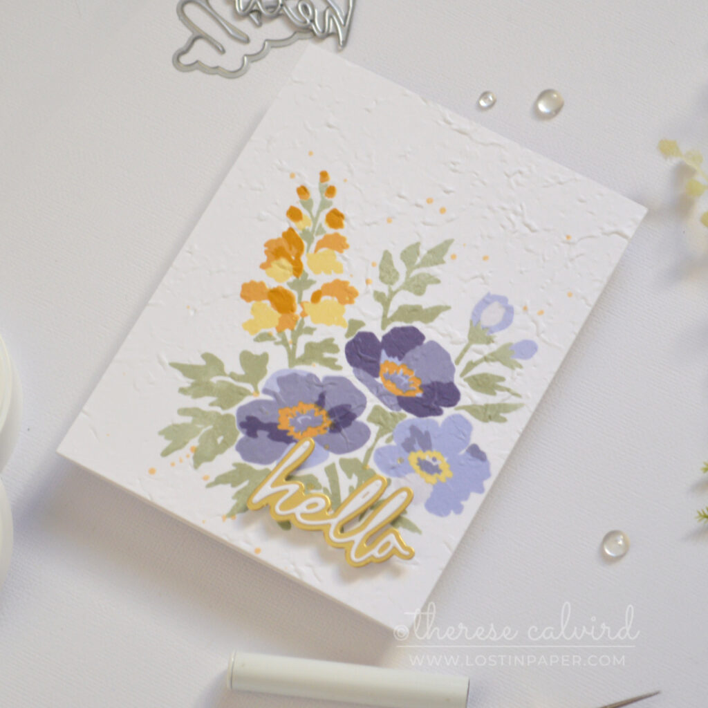 Handmade stamped floral bouquet card with embossed texture and a layered hello sentiment.
