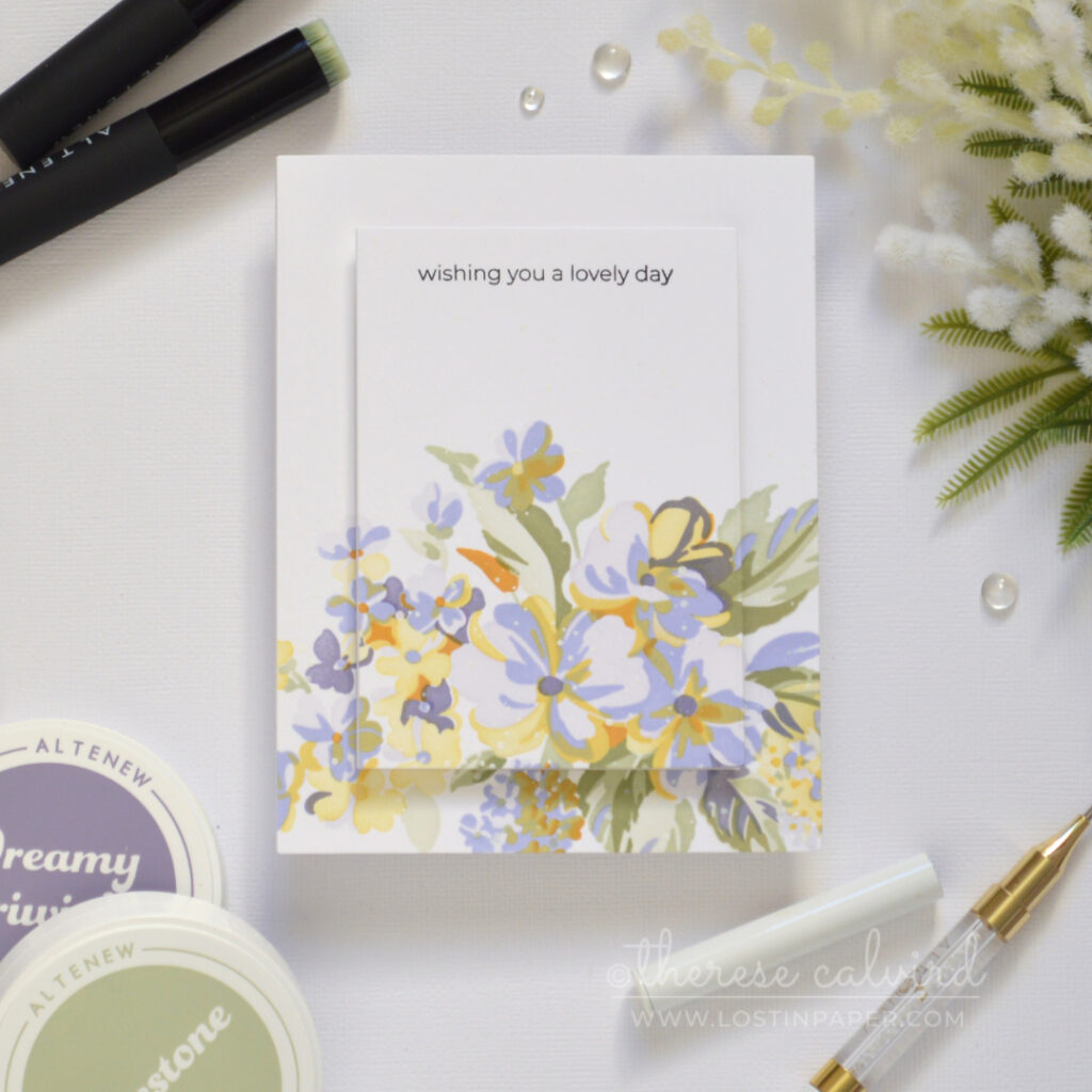 Handmade stenciled floral bouquet card with a raised centre panel and black stamped sentiment.