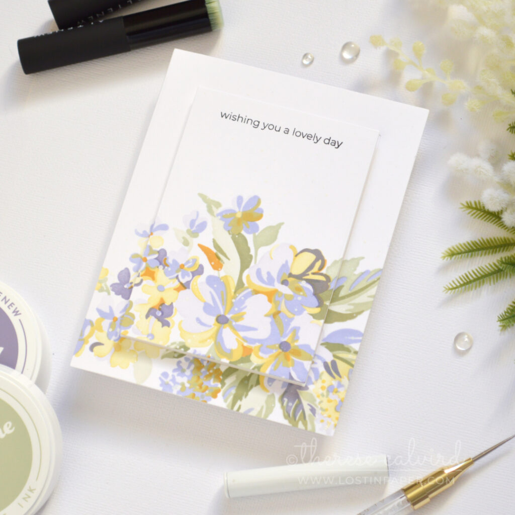 Handmade stenciled floral bouquet card with a raised centre panel and black stamped sentiment.