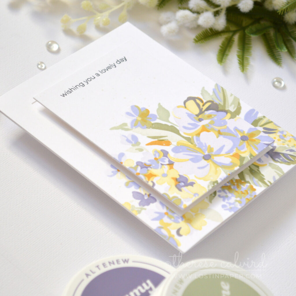 Handmade stenciled floral bouquet card with a raised centre panel and black stamped sentiment.