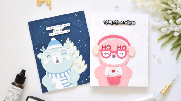 Pink penguin and blue bear monochromatic Christmas cards with layered die cuts and winter backgrounds.