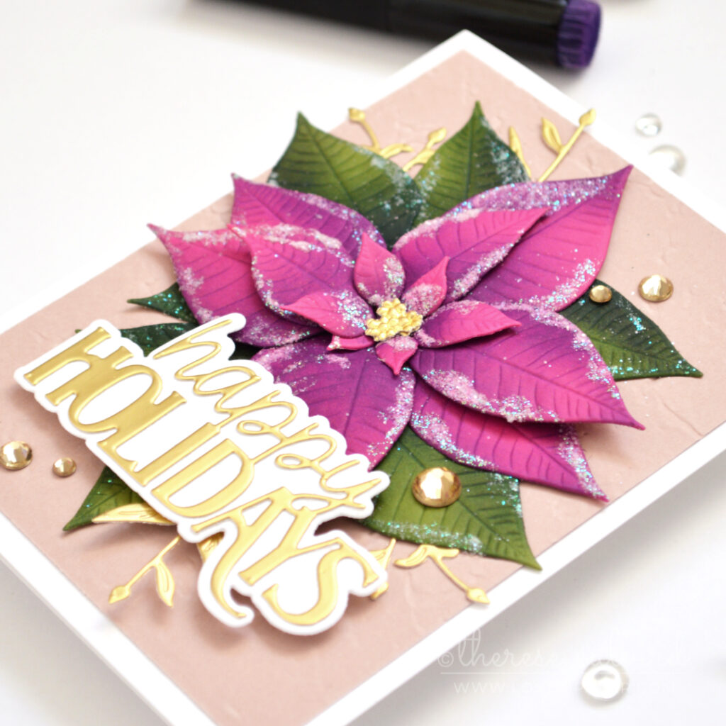 Handmade Christmas card featuring a layered embossed poinsettia with sugary sparkle and a reverse embossed background by Therese Calvird.