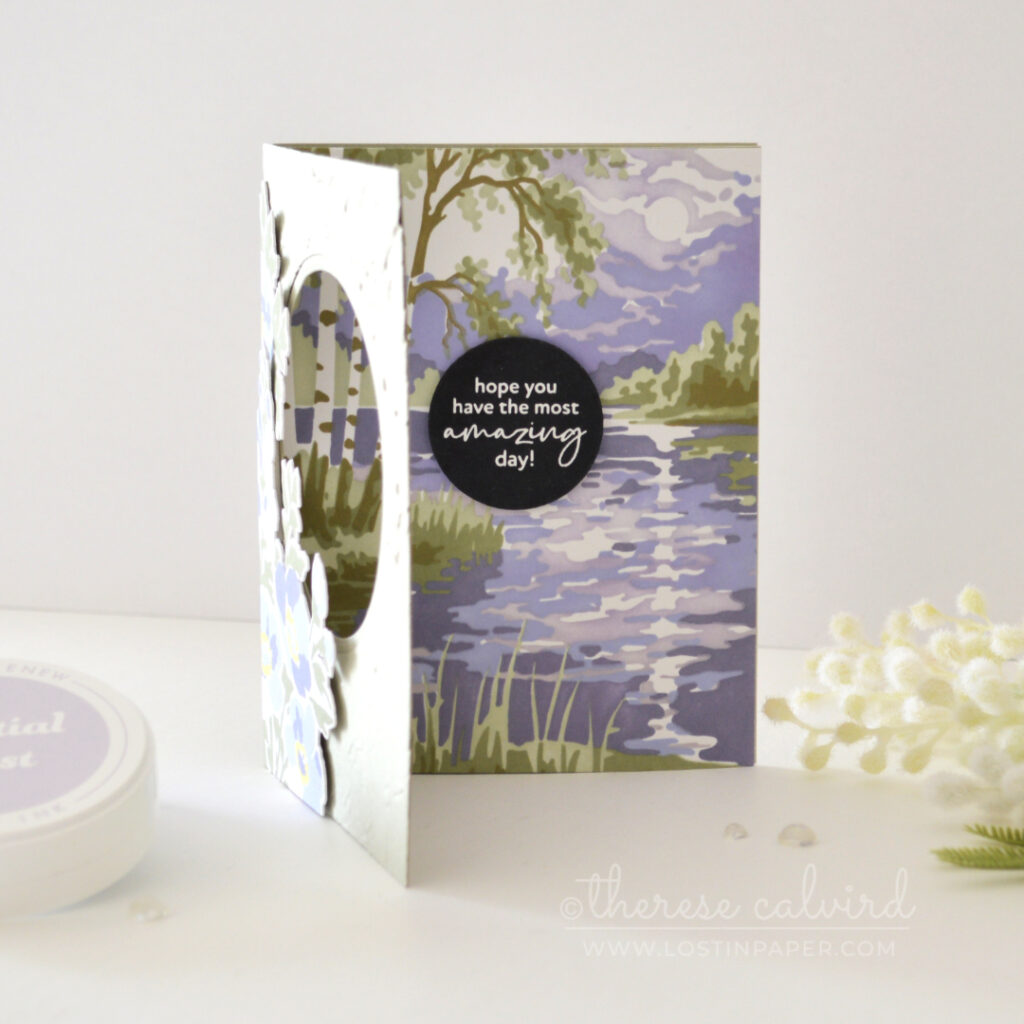 Sage green and purple floral trifold card with an embossed front, circle window, bold sentiment and soft stenciled landscape scene.